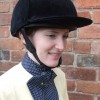 A Cotton Stock in dark blue and white spots worn with a ladies yellow stock shirt and velvet hat cover.