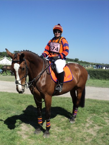 Sarah Paton in her orange and purple cotton drill shirt, saddlecloth and  RS2010.