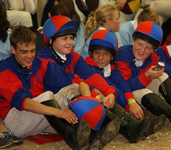 The North Shropshire Pony Club Tetrathlon team in their winning colours. Their colours are the cotton drill shirts in red and royal blue quartered with matching lycra hat covers