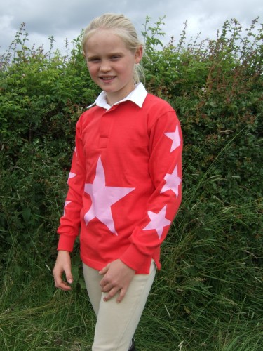 Red rugby shirt with pink stars.