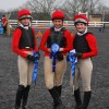 New Hall School Riding Team in their lycra printed hat covers and ladies long sleeve teeshirts.
