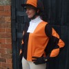 Orange and black halved event shirt, with 3 diamonds on the sleeves and a quartered silk cap with pom.