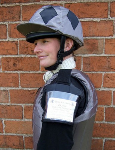 Sophie Talbot in a dark grey body protector with black shoulder pads