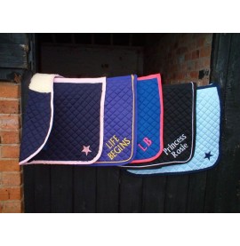 Examples of saddlecloths with plain lettering